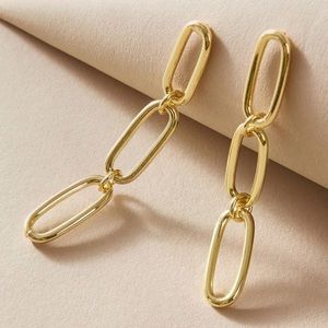 Gold tone paperclip link dangle earrings